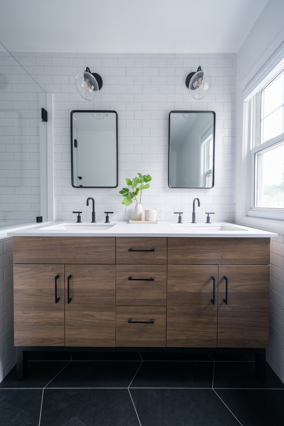 Bathroom vanity and material finishes in a completed space