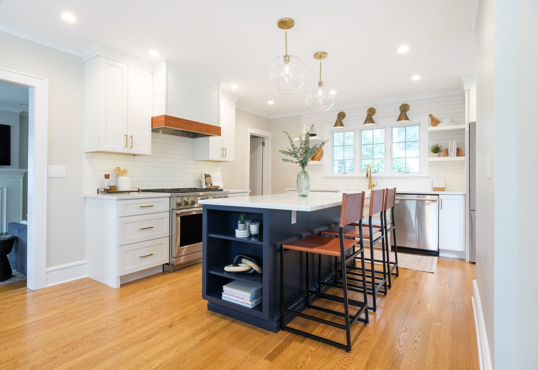 Custom kitchen cabinetry and stone island in a finished home